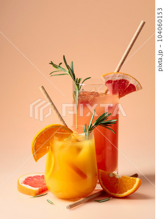Cocktails with grapefruit, orange, rosemary, and ice. 104060153