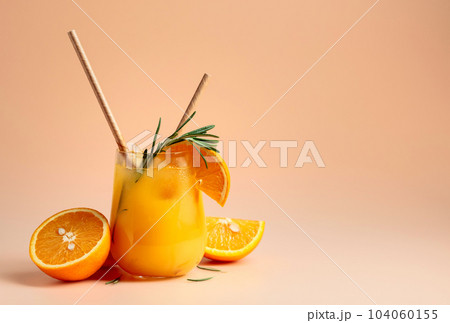 Cocktail with orange, rosemary, and ice in a frozen glass. 104060155