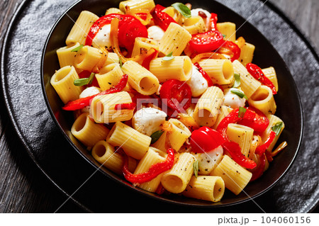pepper tomato mozzarella pasta salad in bowl 104060156