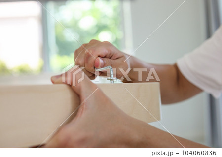 Assembly wooden furniture at home using screw allen 104060836