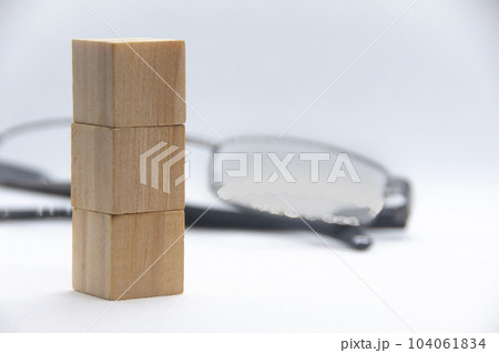 Wooden cube stacked on white cover background with customizable space for text. Copy space Wooden cube stacked on white cover background with customizable space for text. Copy space 104061834