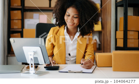 Small business entrepreneur SME freelance woman working at home office, BOX,tablet and laptop online, marketing, packaging, delivery,  e-commerce concept. 104064277