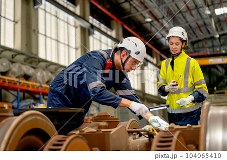 Professional technician or engineer try to check and fix the problem part of electric train and work 104065410