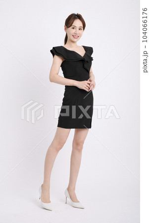 Happy young  woman posing isolated over white 104066176