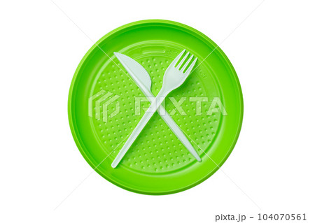 Green plastic plate with fork and knife isolated on white background. 104070561