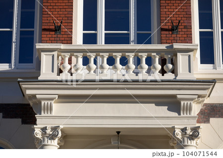 A view of a richly decorated balcony in a historic building maintained in the Neo-Gothic style. A view of a richly decorated balcony in a historic building maintained in the Neo-Gothic style. 104071544