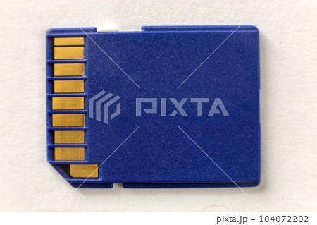 Close-up of blue micro SD memory card isolated on white copy space background. Modern electronic technology, information saving concept. 104072202