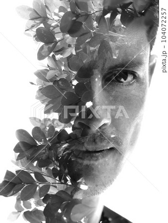 Black and white full frontal double exposure portrait of a man. Closeup 104072257