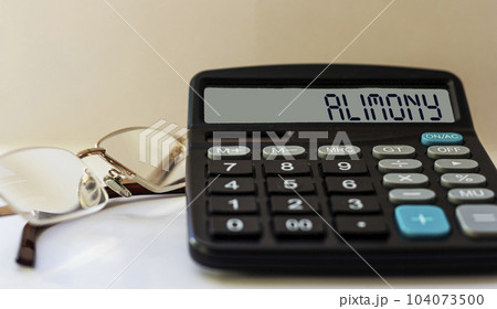Calculator with the word alimony on the display 104073500