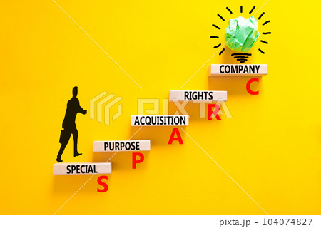 SPARC special purpose acquisition company symbol. Concept words SPARC special purpose acquisition company on wooden block. Yellow background. Business SPARC special purpose acquisition company concept 104074827