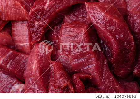 Juicy raw beef with spices, salt and herbs on a dark concrete background 104076963