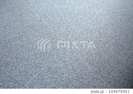 silver gray glitter texture christmas background. Bent shiny velvet paper. silver gray glitter texture christmas background. Bent shiny velvet paper. 104078981