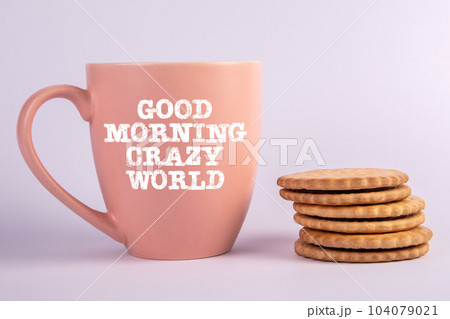 Good Morning crazy world. A cup of coffee and a stack of cookies on a white background 104079021