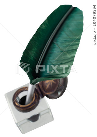 Old vintage feather quill with glass inkwell Old vintage feather quill with glass inkwell 104079594