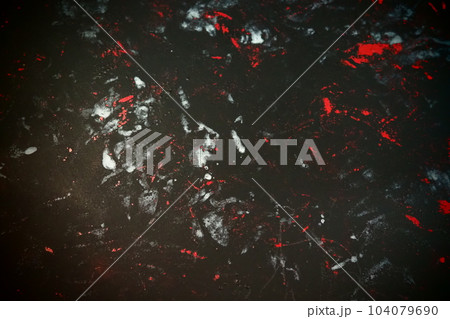 Black background with red, white, gray and blue strokes, dashes, stains and scuffs. A ray of light 104079690