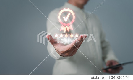 Assessment quality assurance of business services. Man hand showing the best quality assurance with five stars. Guarantee, warranty, standard, ISO certification, review, feedback, testimonial concept. 104080576