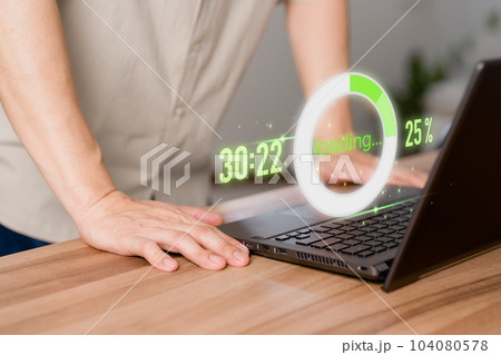 Adult man using a laptop computer for download software and waiting to loading digital business data form website, very slow internet form wifi. Concept of waiting for load of loading symbol. 104080578