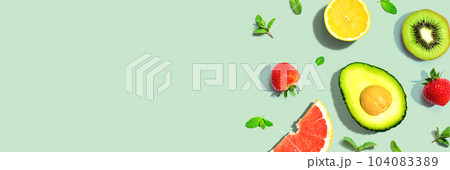 Avocado and mixed fruits overhead view 104083389