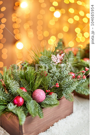 Christmas wooden box with fir branches for the holiday. The new year celebration. European flower shop 104085954