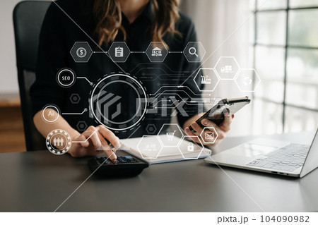 Woman accountant use Laptop and calculator to calculate the company's financial with icon banking on data network of finance and banking with business growth 104090982