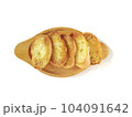 Several slices of garlic bread were placed on a wooden plate. 104091642