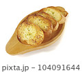 Several slices of garlic bread were placed on a wooden plate. 104091644