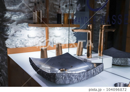 Closeup of fancy sink and faucet reflecting on mirror in modern bathroom at luxurious hotel, luxury travel and holiday concept for tourists 104096872