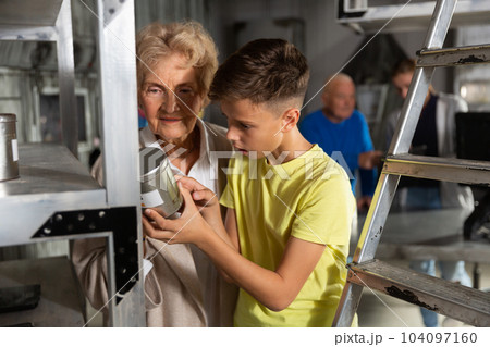 Grandparents and kids in escape room 104097160