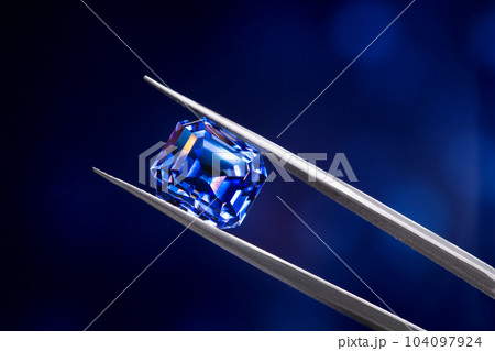 Blue Sapphire Gemstone in Jewelry Tweezers Blue Sapphire Gemstone in Jewelry Tweezers 104097924