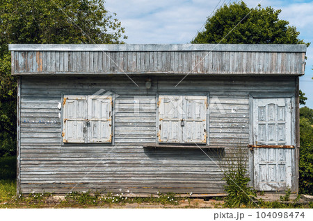 Closed old wooden kiosk in the village 104098474