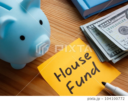 Piggy bank, cash and sticker with inscription house fund. Piggy bank, cash and sticker with inscription house fund. 104100772