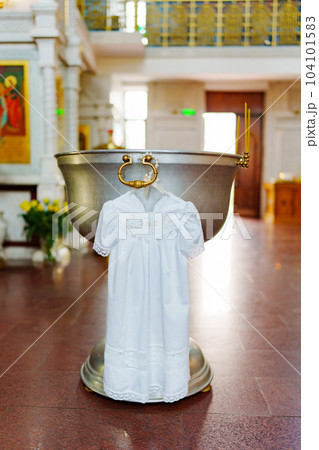 the baptismal shirt hangs on Baptismal font in the Orthodox Church. the baptismal shirt hangs on Baptismal font in the Orthodox Church. 104101583