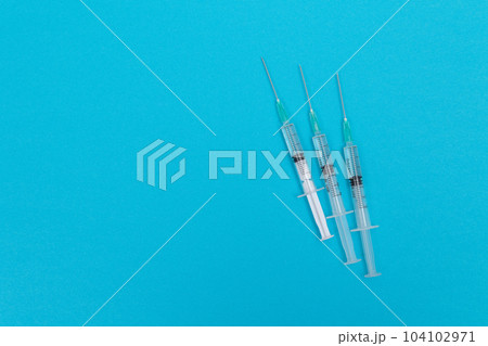 Several Syringe on Blue Table Several Syringe on Blue Table 104102971