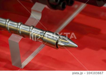 Close up scene  the end of injection machine screw spare parts. Close up scene  the end of injection machine screw spare parts. 104103667