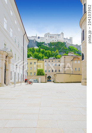 Hohensalzburg Fortress in Salzburg city in Austria, as seen from the Residence Square (Residenzplatz), in the old town and historic centre. Large medieval fortress atop a hill called the Festungsberg. 104103982