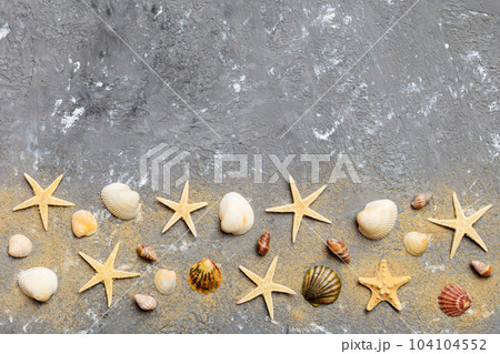 Summer time concept Flat lay composition with beautiful starfish and sea shells on colored table, top view with copy space for text Summer time concept Flat lay composition with beautiful starfish and sea shells on colored table, top view with copy space for text 104104552