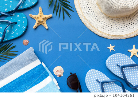 Summer vacation concept flat lay. straw hat beach accessories and towel top view. Space for text. travel concept Summer vacation concept flat lay. straw hat beach accessories and towel top view. Space for text. travel concept 104104561