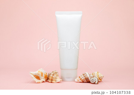 cosmetic cream tube, sea shells on pink background. mockup, skincare product blank plastic package. lotion, balsam, toothpaste, lubricant, cleanser, moisturizer. white bottle cosmetic cream tube, sea shells on pink background. mockup, skincare product blank plastic package. lotion, balsam, toothpaste, lubricant, cleanser, moisturizer. white bottle 104107338