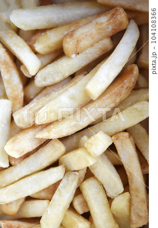 French fries in a cardboard box. Fast food. Fried potatoes. A delicious snack. 104108366