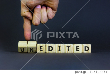 Edited or unedited symbol. Businessman turns wooden cubes and changes the word unedited to edited. Business and edited or unedited concept. Beautiful grey background, copy space. Edited or unedited symbol. Businessman turns wooden cubes and changes the word unedited to edited. Business and edited or unedited concept. Beautiful grey background, copy space. 104108834