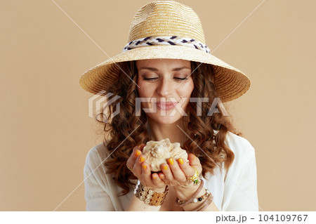happy woman in blouse and shorts isolated on beige happy woman in blouse and shorts isolated on beige 104109767