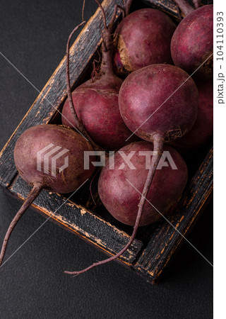 Fresh raw beetroot in the form of tubers on a textured concrete background Fresh raw beetroot in the form of tubers on a textured concrete background 104110393