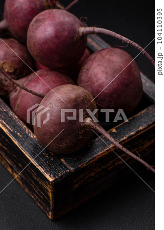 Fresh raw beetroot in the form of tubers on a textured concrete background Fresh raw beetroot in the form of tubers on a textured concrete background 104110395