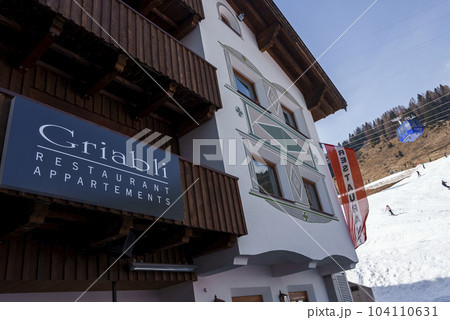 Exterior of restaurant located near ski resort at snow covered mountain peak, winter holiday travel concept 104110631