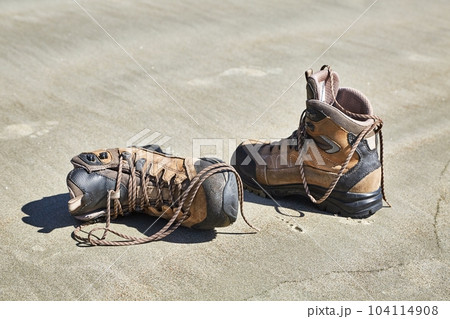 Boots taken off in the sand Boots taken off in the sand 104114908