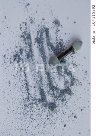 Blue or gray eye shadow with applicator on white background 104115592