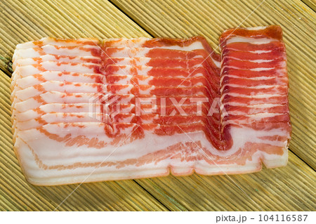 Slices of jamon or traditional spanish panceta curada 104116587