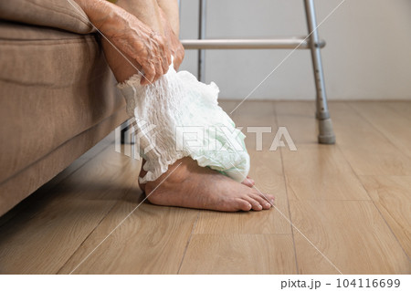 Urinary Incontinence in elderly and changing diaper 104116699