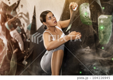 Woman training at bouldering gym without special climbing equipment Woman training at bouldering gym without special climbing equipment 104116945