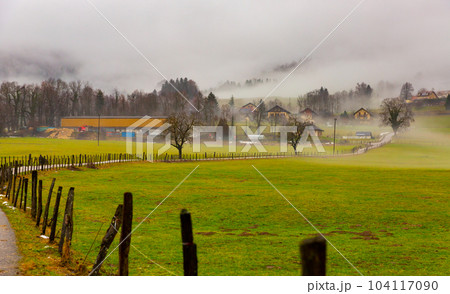 Thick fog over rural houses at French Alps Thick fog over rural houses at French Alps 104117090